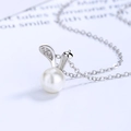 Elegant 925 silver rabbit ear pearl necklace with shimmering zircon stones on white background - 925 Silver / White Gold