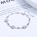 Silver four-leaf clover bracelet with three sparkling zircons and adjustable lobster clasp - 925 Silver / Clear Zirconia - Platinum Color