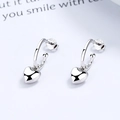 Pendientes de aro con corazón de plata de ley S925 pulida sobre fondo blanco puro - Plata 925 / Oro Blanco