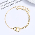 Gold interlocking double circle bracelet with cubic zirconia and asymmetric chain links - 925 Silver / Gold