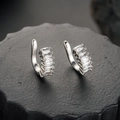 Detailed view of silver ear cuffs with rectangular cubic zirconia in a prong setting - Silver (Single)