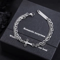 Double-layered silver cross bracelet with ID tag displayed on a premium black gift box - Silver (Cross Bracelet)