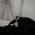 Double-layer silver Cuban chain necklace with vintage Venus coin pendant on dark fabric - Venus Portrait Double Layered Necklace (L034-A)