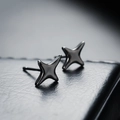 Gunmetal four-pointed star stud earrings with a sleek minimalist metallic finish - Cross Star Stud Earrings / Black (X118-C)