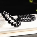 Minimalist black glass bead bracelets set with polished finish on a white background - 12mm Style (S082-A)