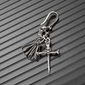 Detail of vintage punk skull keychain with embossed hook and silver bone pendants - Silver