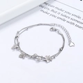 Bracciale a doppio strato in argento 925 con foglie d'acero e perline opache su fondo bianco - Argento 925 / Oro Bianco