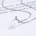Elegant 925 sterling silver box chain necklace with a round white pearl pendant charm - Platinum Necklace