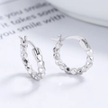 S925 sterling silver hoop earrings with a textured geometric diamond cut pattern - 925 Silver / White Gold