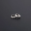 Close-up of silver frosted titanium steel hoop earrings with a matte textured surface - Matte Silver
