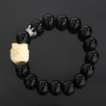 Obsidian bead bracelet with white guardian lion head and silver crown charm accent - Dancing Lion Obsidian Style