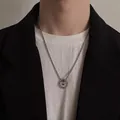 Mens vintage mantra spinner pendant necklace with silver braided chain on model - Double Ring Nested Six-Word Proverb Necklace (L8886-A)