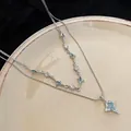 Zweilagige Halskette aus silberfarbenem Titanstahl mit blauem Zirkon-Sternanhänger - Vierzackiger Stern Doppellagig (L654-A)