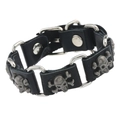 Bracciale punk in pelle nera da uomo con teschi in metallo e bottoni a scatto - Nero