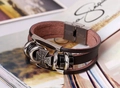 Detail of multi-layer brown leather bracelet with cross emblem and stainless steel clasp - Dark Brown