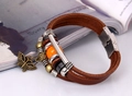 Detail of multilayer brown leather bracelet with bronze butterfly charm and orange bead - Dark Brown