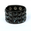 Detail of punk wide black leather bracelet with triple rows of blue splattered square studs - Black