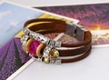 Detail shot of multi-layer braided leather bracelet with purple crystal and metal beads - Dark Brown