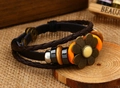 Detailed view of a retro layered leather bracelet with bronze flower and snap closure - Beige Flower