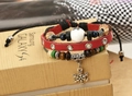 Detail of three-layer vintage bracelet with leather, red PU band and snowflake charm - Red