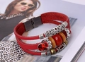 Detail of red multilayer leather bracelet with boho beads and sparkling red crystals - Red