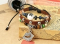 Detail of multilayer leather bracelet with ethnic beads and silver lip pendant detail - Brown