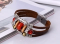 Detail shot of multi-layer leather bracelet with red gemstone and vintage metal tubes - Dark Brown
