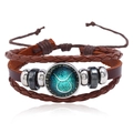 Detail of multi-layer brown leather Taurus zodiac bracelet with braided cord and metal beads - Taurus