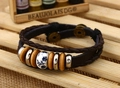 Detail of multilayer braided leather bracelet with blue ceramic bead and metal clasp - Blue and White Porcelain Beads