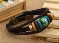 Detail of vintage braided leather bracelet with turquoise beads and antique metal clasp - Blue-green porcelain bead