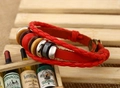Close-up of multilayer red braided leather bracelet with ethnic wooden and metal beads - China red porcelain bead