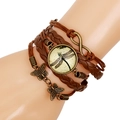 Close-up of a vintage leather layered bracelet with dragonfly and butterfly charms - Dragonfly Style (Model C)