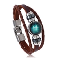 Detail of Piscess zodiac multilayer leather bracelet with woven cords and glass dome charm - Pisces