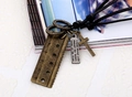 Macro view of retro punk leather necklace with alloy ruler and engraved plate pendant - Bronze
