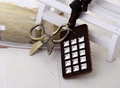 Detail of vintage rock style necklace with bronze scissors and studded leather tag - Scissors Design