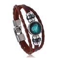 Macro detail of brown leather braided Leo constellation bracelet with metallic beads - Leo