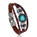Detailed close-up of brown braided leather Gemini zodiac bracelet with metal beads - Gemini