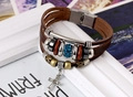 Detail of multilayer vintage leather bracelet with metal cross charm and blue crystal bead - Dark Brown