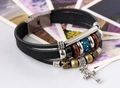 Detail view of retro multilayer leather bracelet with silver cross and blue rhinestones - Black