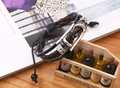 Detail of dark brown multi-layer braided leather bracelet with silver metal charms - Brown