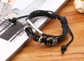 Detail of multi-layer braided leather bracelet with silver metal beads and S-pattern charms - Black