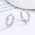 Elegant 925 sterling silver twisted hoop earrings with micro-pave zirconia crystals - 925 Silver / White Gold