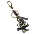 Vintage bronze zodiac keychain with leather wrap and engraved monster pendant charms - Dragon