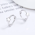 Minimalist 925 sterling silver star hoop earrings with high-polish finish on white background - White Gold
