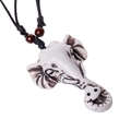 Ethnic elephant head pendant necklace with resin carving and black braided cord - Elephant Head Design