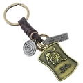 Porte-clés signe Lion en cuir tressé vintage avec pendentifs en laiton et étiquette Leo - Lion