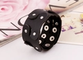 Detail of wide black punk leather bracelet with silver metal studs and snap buttons - Black