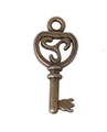 Vintage heart-shaped bronze key pendant with triskelion detail for DIY jewelry - Key