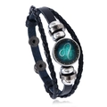 Detail of multi-layer braided leather bracelet with Leo zodiac glass charm and beads - Leo
