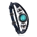 Detail of multilayer leather bracelet featuring a Cancer zodiac sign glass dome charm - Cancer